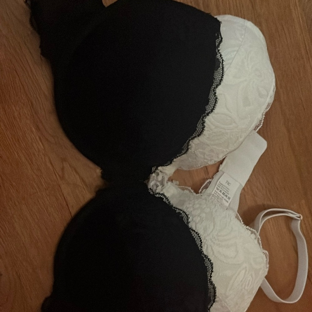 2 lace bras (one white one black) never used size 75c which fits a 36 c
